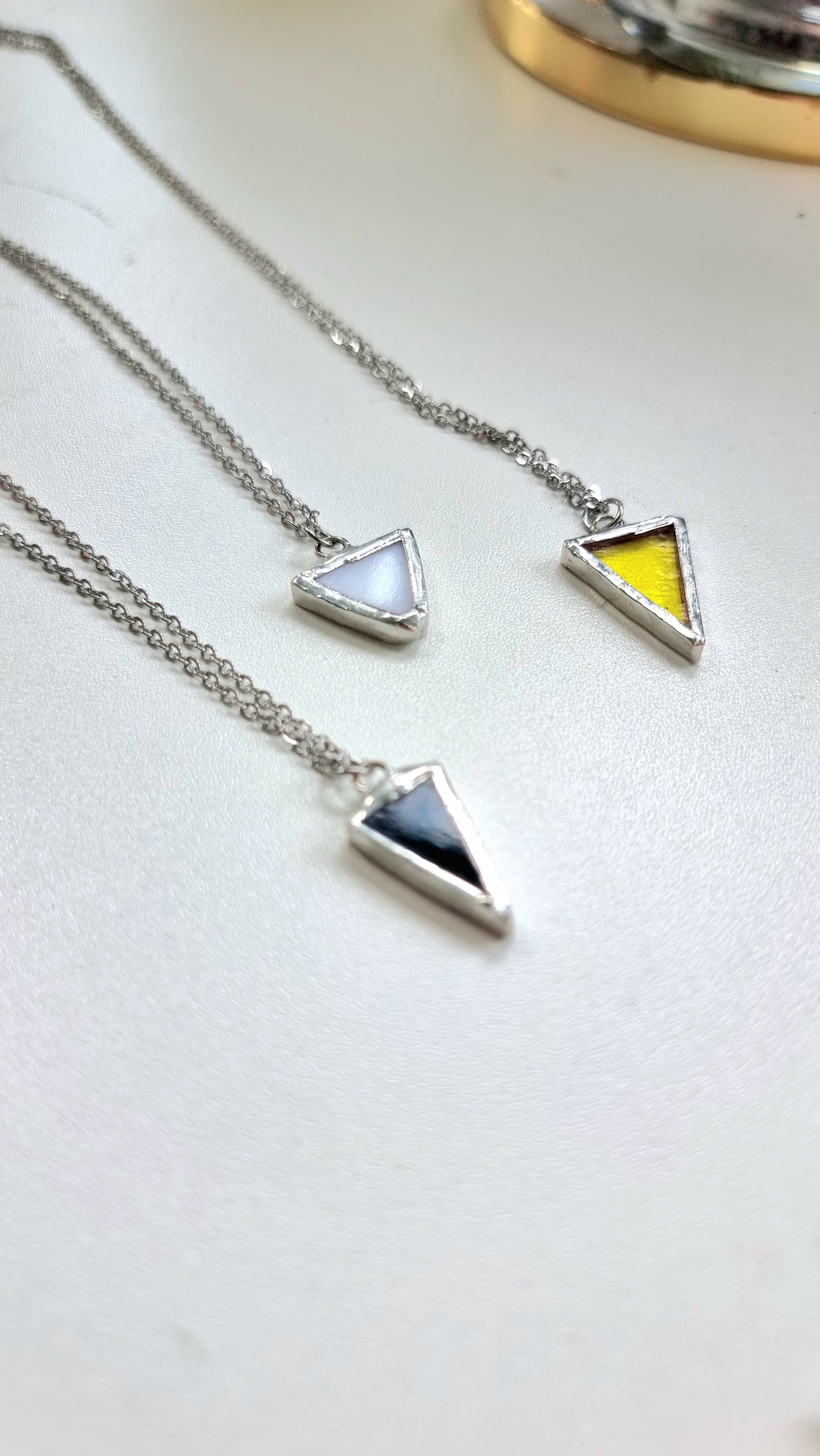 Small triangle necklaces